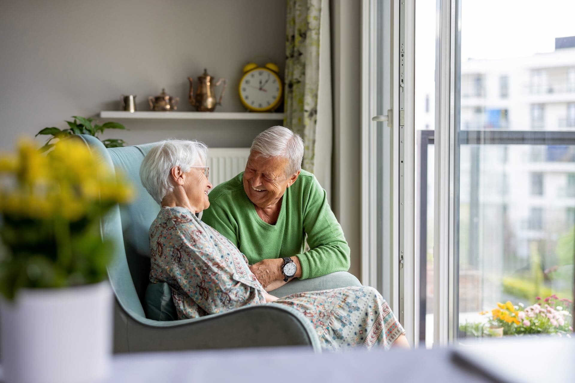 An elderly couple smiling